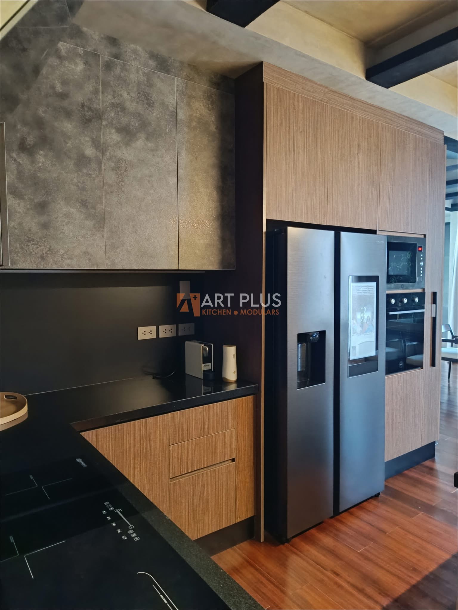 Wood grain kitchen cabinets with built-in tall pantry and appliances