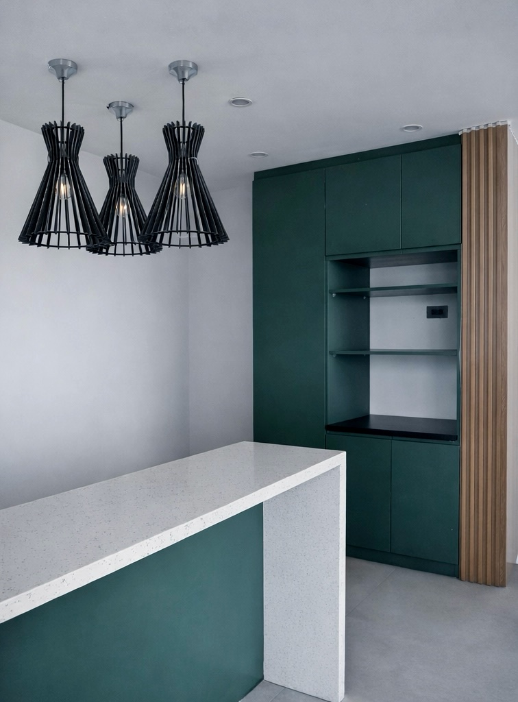 Green pantry cabinet with terrazzo island and wood slat accent