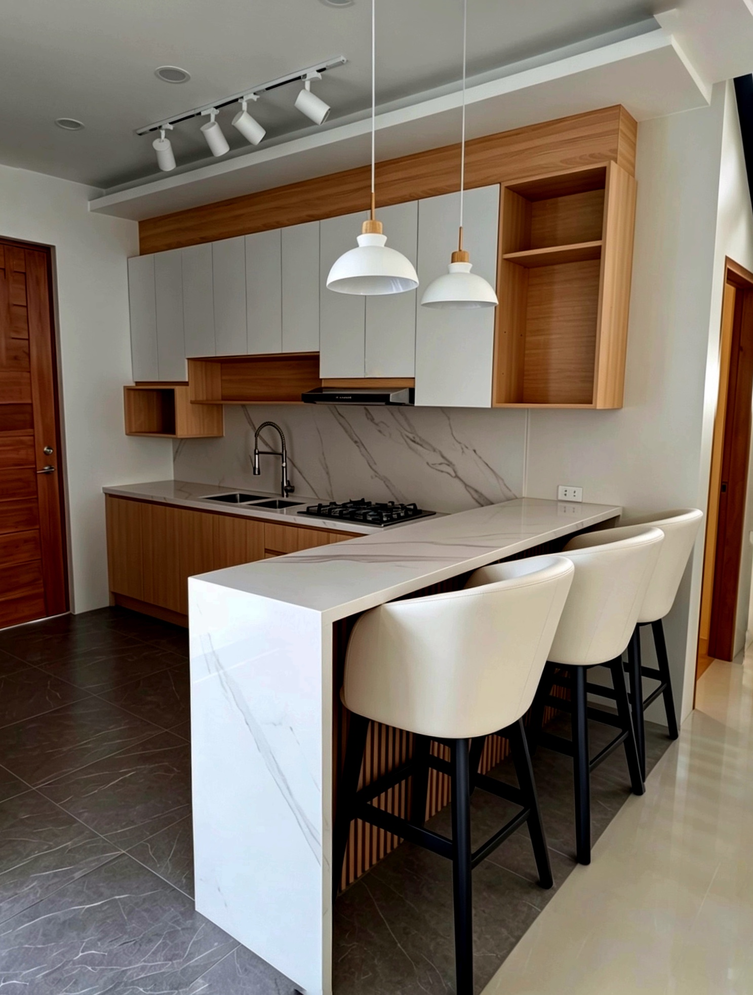 Modern kitchen with white and wood cabinets, marble island and pendant lights